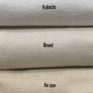 May include: Five fabric swatches in different shades of white and beige. The swatches are labeled from top to bottom: White, Avalanche, Almond, Marzipan, and Oatmeal.