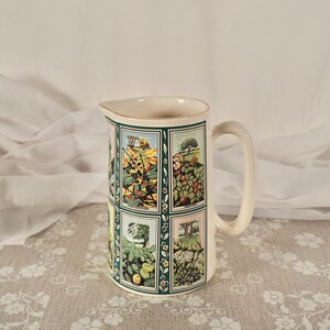 May include: A set of three ceramic mugs with a speckled, matte finish in cream, light grey, and dark grey. Each mug has a simple, minimalist design and a rounded handle.