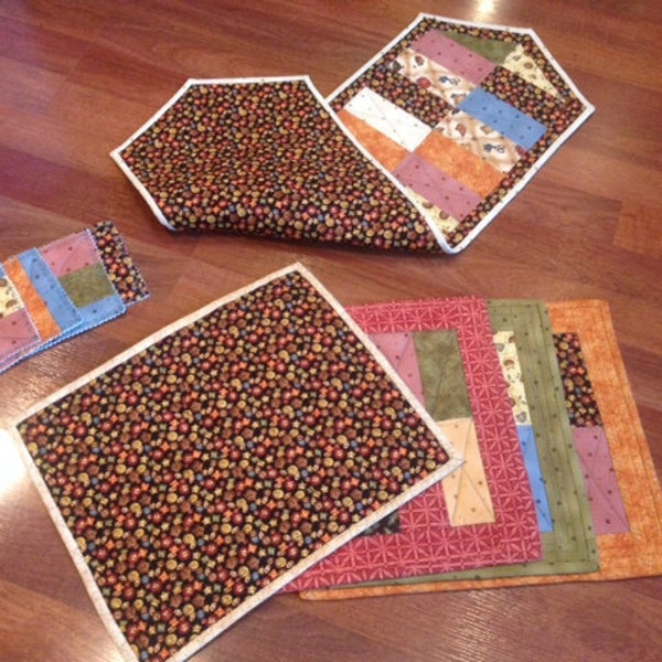 Reversible hand made set of place mats, runner and coasters. Jacqueline Paton folk art fabric collection