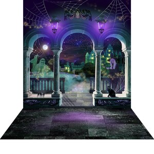 A Halloween photo backdrop with a stone balcony, arches, a glowing green castle, a ghost, a witch figure, a black cat, and spiderwebs against a purple night sky.