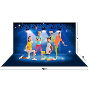 May include: A blue backdrop for photography, 10ft wide and 5ft high, featuring four young dancers in colorful outfits. The backdrop has a stage lighting design with spotlights and stars, creating a performance setting.