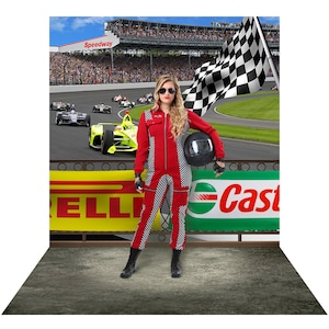 May include: A woman wearing a red and black racing suit stands in front of a checkered flag and a race track backdrop. She is holding a black helmet in her right hand. The background features a race track with cars and spectators. The words "Speedway" and "Castrol" are visible on the signs.