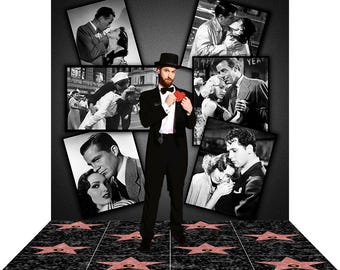 May include: A man in a black tuxedo and top hat stands on a floor with red star imprints, surrounded by black and white movie stills. He holds a red heart-shaped object. The background is dark gray.