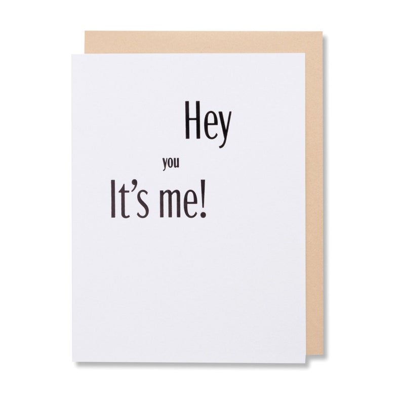 Black foil stamped Hey you It's me! Thinking of you greeting card. Bright white thick cover paper with a tan envelope.