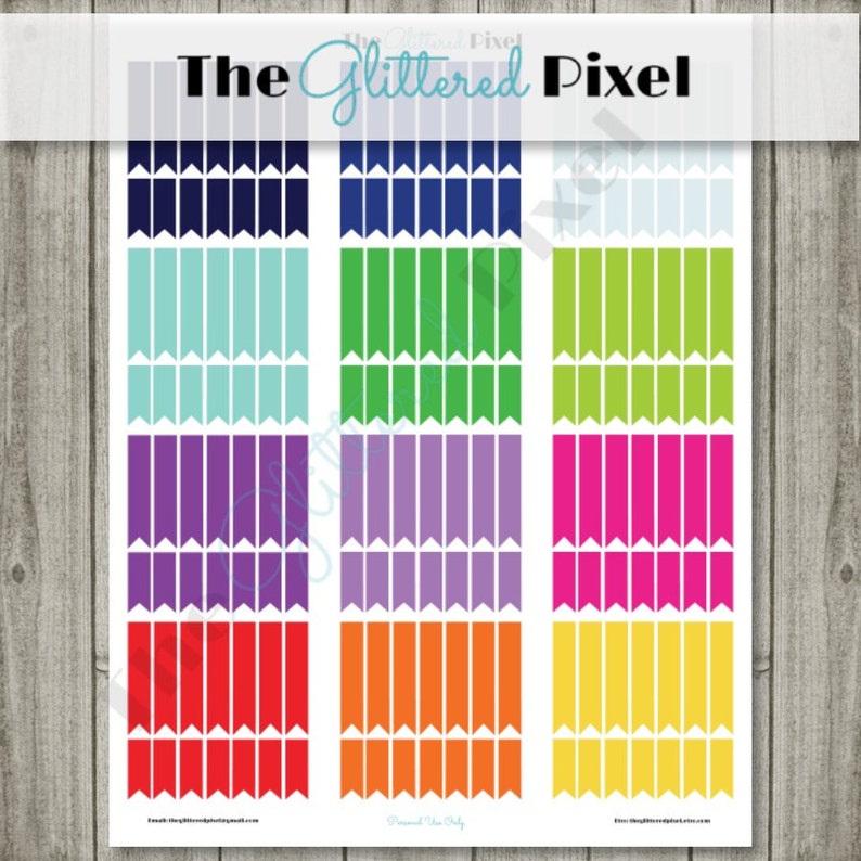 May include: A sheet of colorful planner stickers featuring a variety of flag-shaped designs in shades of blue, green, purple, orange, red, and yellow. The text "The Glittered Pixel" is at the top. The stickers are arranged in vertical columns.