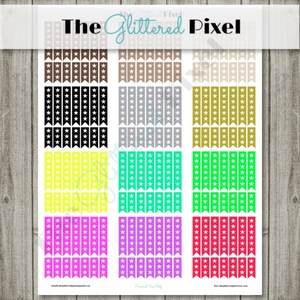May include: Sheet of colorful star-themed stickers. The stickers are arranged in vertical rows and feature various colors, including brown, black, silver, gold, yellow, teal, green, pink, purple, and red. The text "The Glittered Pixel" is at the top.
