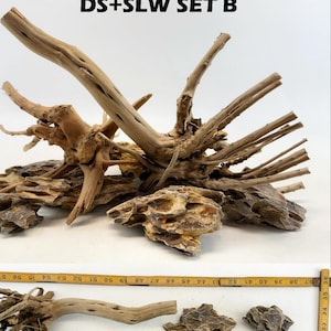 May include: A set of driftwood and rock for aquascaping. The set includes a large piece of driftwood with branches, a smaller piece of driftwood with roots, and several pieces of brown and tan rock.