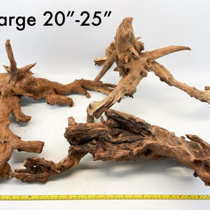 May include: Three pieces of brown driftwood, ranging in size from 20 to 25 inches. The driftwood is perfect for use in aquariums, terrariums, or as decorative pieces.