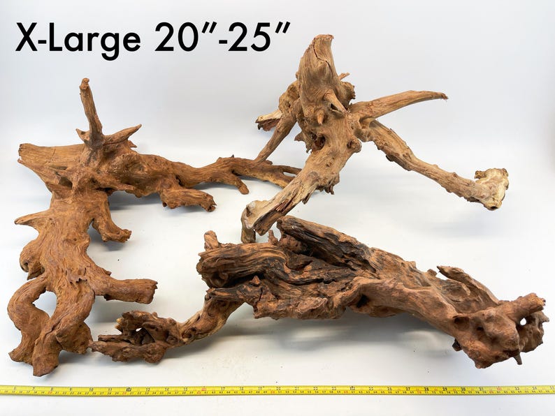 May include: Three pieces of brown driftwood, ranging in size from 20 to 25 inches. The driftwood is perfect for use in aquariums, terrariums, or as decorative pieces.