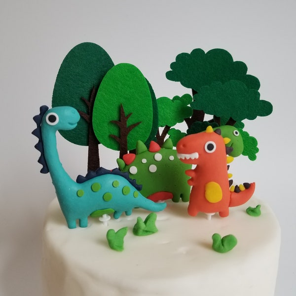 Handmade cute clay felt dinosaur and trees cake toppers for children birthday cake design your own cake reusable and fun