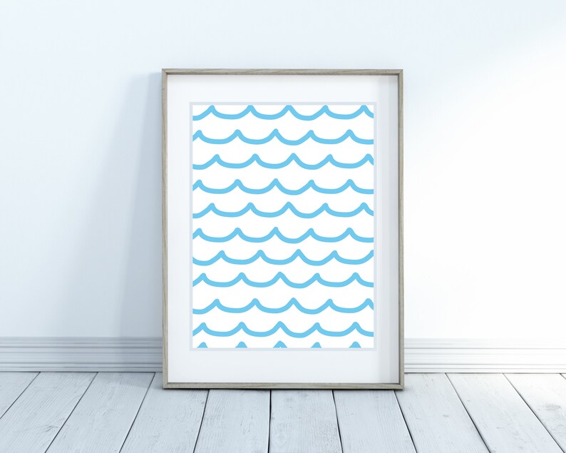 May include: A framed print with a blue and white wave pattern. The waves are stylized and create a repeating pattern.