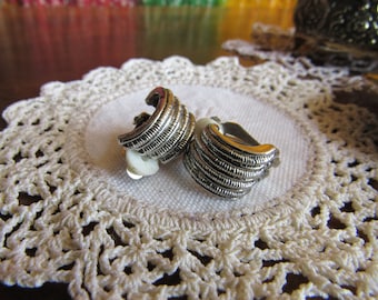 Silver Tone Curve Clip Earrings