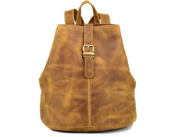 May include: A brown leather backpack with a single buckle closure. The backpack has a distressed look and is made of a soft, supple leather.