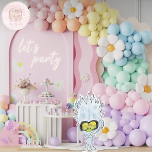 May include: A pastel-colored birthday party backdrop with a balloon arch, flowers, and the text "Let's Party". A white table with a cake and other treats is in the foreground. A cartoon character with blue hair and yellow eyes is standing in front of the table.