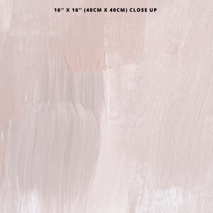 May include: A close-up of a light pink and white abstract painting with brushstrokes. The painting is 16 inches by 16 inches (40 cm by 40 cm).
