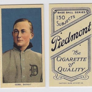 May include: Vintage baseball card featuring a portrait of a man in a gray baseball uniform with a "D" on the chest. The card reads "COBB, DETROIT" at the bottom. The reverse side of the card has the text "Piedmont" and "The Cigarette of Quality."
