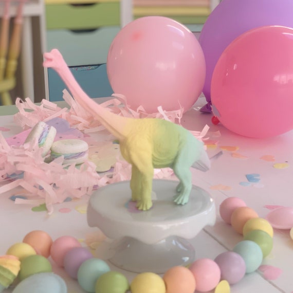 Pink plastic dinosaur toy hotsell