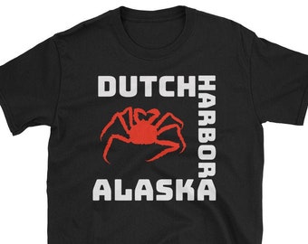 May include: Black t-shirt with white text that reads "DUTCH HARBOR ALASKA" and a red crab illustration.