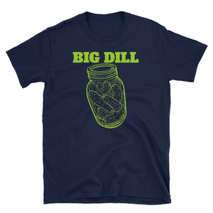 May include: Navy blue t-shirt with a lime green graphic of a jar of pickles and the text "BIG DILL" above the jar. The graphic is a line drawing style. The shirt is made of a soft material.