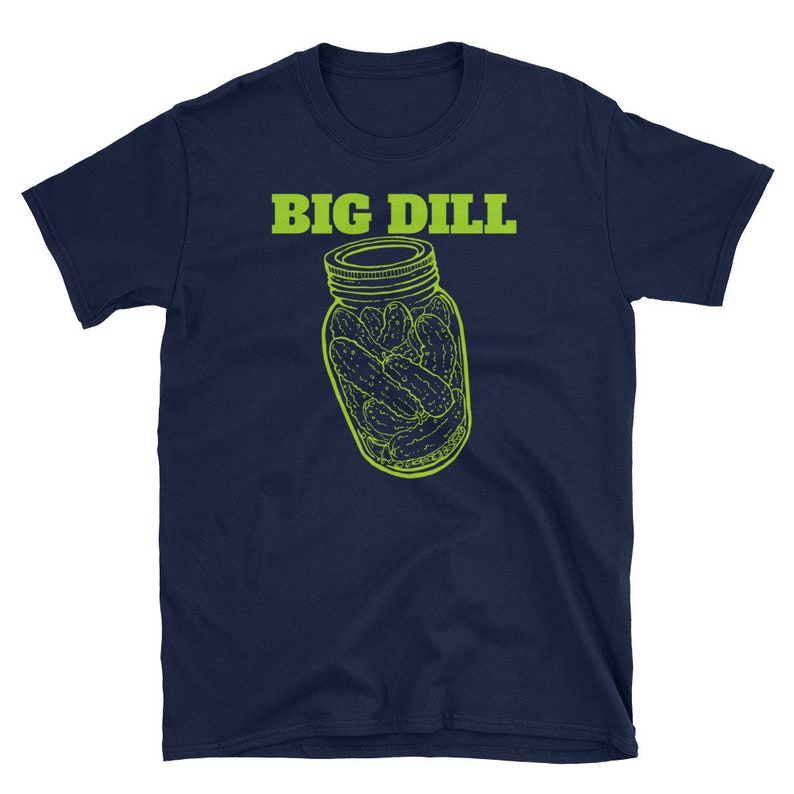 May include: Navy blue t-shirt with a lime green graphic of a jar of pickles and the text "BIG DILL" above the jar. The graphic is a line drawing style. The shirt is made of a soft material.
