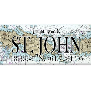 May include: A nautical chart print of St. John, Virgin Islands. The print features a detailed map of the island with its coastline, waterways, and surrounding islands. The name "ST. JOHN" is prominently displayed in black lettering, along with the coordinates "18.3368° N, -64.7281° W".