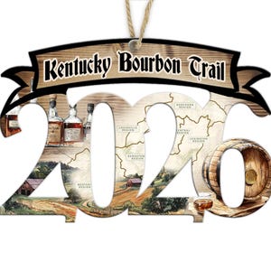 May include: Wooden ornament featuring the text "Kentucky Bourbon Trail" above the numbers "2020". The numbers are filled with images of bourbon bottles, a map, and a barrel. A small glass of bourbon is also visible.