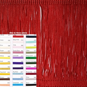 May include: A close-up of red fringe trim. The fringe is made of thin, tightly woven strands of yarn. The image also shows a colour chart with various colours and corresponding numbers.