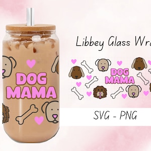 May include: A clear glass tumbler with a bamboo lid and a straw. The tumbler is filled with a brown liquid and has a pink and brown design with the words "Dog Mama" and images of dogs and bones.