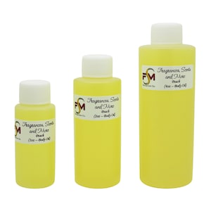 May include: Three bottles of body oil in different sizes. The bottles are clear and yellow, with white lids. The labels on the bottles say "Fragrances, Scents and More" and "Peach". The bottles are labeled with the size in ounces: 1 oz, 2 oz, and 4 oz.
