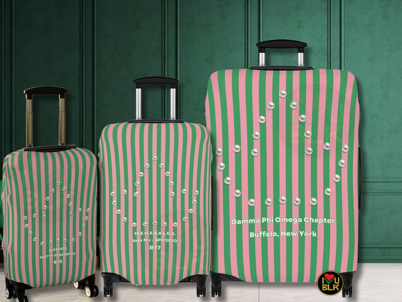 Divine Nine themed pink and green sorority personalized luggage covers. Shown in three sizes Small, Medium, and Large. Luggage covers are striped in pink and green and feature an ivy leaf shape formed by pearls on the front side. Personalized text is printed under the ivy leaf. The three suitcases are lined up in the photo from smallest to largest and are in front of a green paneled wall. The covers were designed to be used by members of Alpha Kappa Alpha.