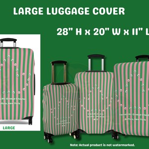 May include: A large luggage cover featuring vertical pink and green stripes with a pearl-like triangular design. The text reads Gamma Phi Omega Chapter, Buffalo, New York. The dimensions are 28 inches high, 20 inches wide, and 11 inches long.