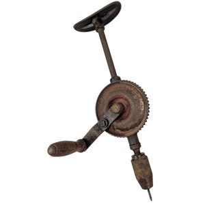 May include: An antique hand drill with a wooden handle and a rusty, circular gear mechanism. The drill has a crank handle and a top handle for turning. The metal components show signs of age and wear, with a dark, aged appearance.