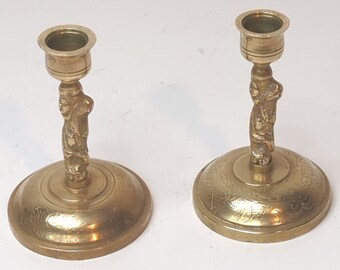 Two matching vintage  antique etched candlesticks solid  brass. Height 4.5"