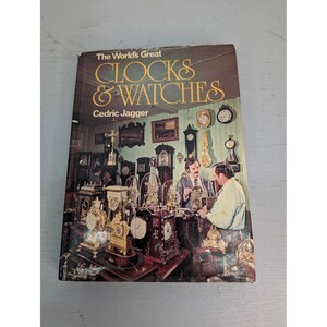 May include: A vintage book titled "The World's Great Clocks & Watches" by Cedric Jagger. The cover features a photograph of a room filled with antique clocks and watches, with two men examining a clock.