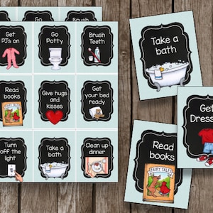 May include: A set of 12 colorful cards with black borders and white text. Each card features a different activity for children, such as getting dressed, reading books, taking a bath, and brushing teeth. The cards are designed to help children learn about daily routines.