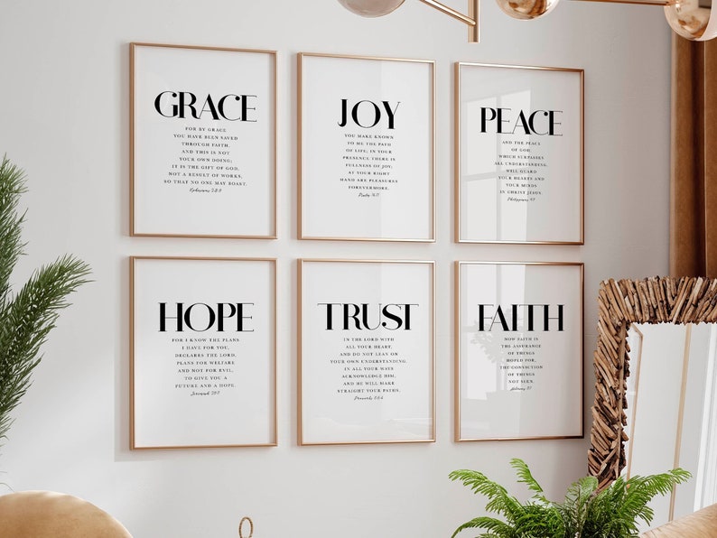 May include: Six framed prints with gold frames, each featuring a different word in bold, "GRACE", "JOY", "PEACE", "HOPE", "TRUST", and "FAITH". Each print includes a Bible verse related to the word.