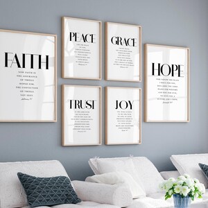 May include: Six framed prints with white backgrounds and black text. The prints feature the words "Faith", "Peace", "Grace", "Hope", "Trust", and "Joy" with bible verses underneath each word.