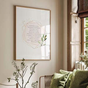May include: A framed print with a white background and a gold geometric frame. The print features a quote from Philippians 4:8, "Whatever is true, whatever is noble, whatever is right, whatever is pure, whatever is lovely, whatever is admirable&mdash;if anything is excellent or praiseworthy&mdash;think about such things." The quote is surrounded by a watercolor illustration of green leaves.
