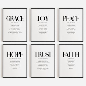 May include: Six black framed prints with white backgrounds and black text. Each print features a different word: Grace, Joy, Peace, Hope, Trust, and Faith. Each word is accompanied by a Bible verse.