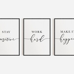 May include: Three framed prints with black frames and white backgrounds. Each print features a motivational phrase in black script: "Stay Positive," "Work Hard," and "Make it Happen."