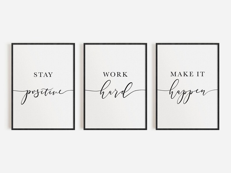 May include: Three framed prints with black frames and white backgrounds. Each print features a motivational phrase in black script: "Stay Positive," "Work Hard," and "Make it Happen."