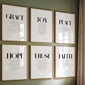 May include: Six framed prints with white backgrounds and black text. Each print features a different word: Grace, Joy, Peace, Hope, Trust, and Faith. Each word is accompanied by a Bible verse.
