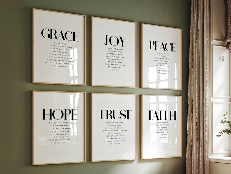 May include: Six framed prints with white backgrounds and black text. Each print features a different word: Grace, Joy, Peace, Hope, Trust, and Faith. Each word is accompanied by a Bible verse.