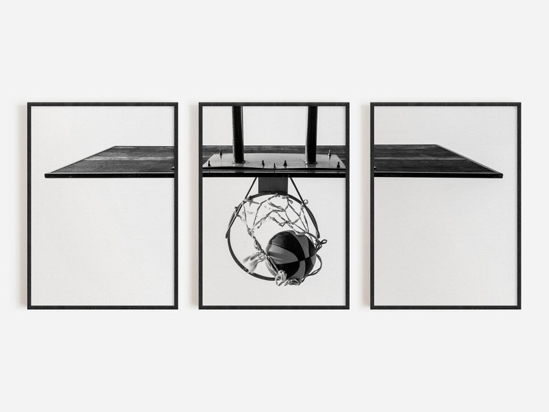 May include: A triptych of three black and white framed prints. The outer two prints show a side view of a basketball backboard. The center print shows a basketball passing through a hoop with a net, attached to a backboard with two vertical poles.