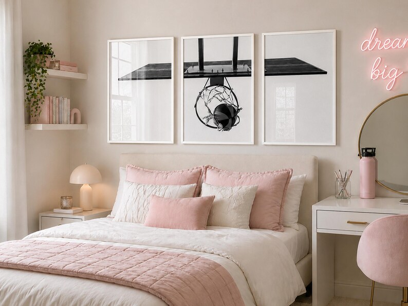 May include: A triptych of framed wall art prints featuring a black and white photograph of a basketball hoop and backboard. The three white frames are arranged horizontally above a bed, displaying a continuous view of the sports equipment.