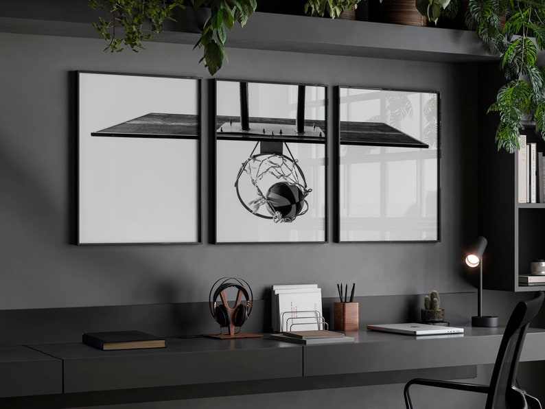 May include: A triptych wall art set featuring a black and white photograph of a basketball hoop and backboard. The central panel displays the hoop with a net and a basketball, while the two side panels show the extended backboard structure.