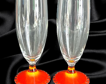 1970s vintage champagne flutes with inset orange red daisy flower base