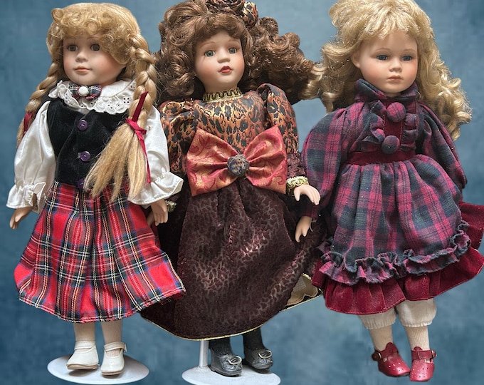 Featured listing image: Vintage 1980s set of 3 unmarked collectible porcelain dolls