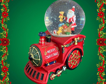 Noel by Lamart Santa on train locomotive windup musical snowglobe