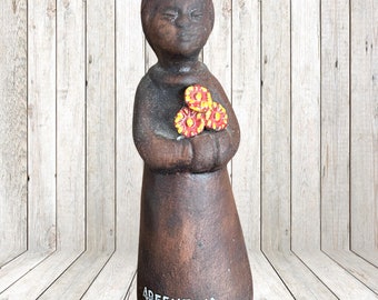 Argentina small vintage 1980s basalt glaze souvenir figurine girl with flowers